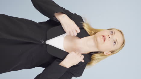 Vertical-video-of-Stressed-business-woman-loosens-her-tie.
